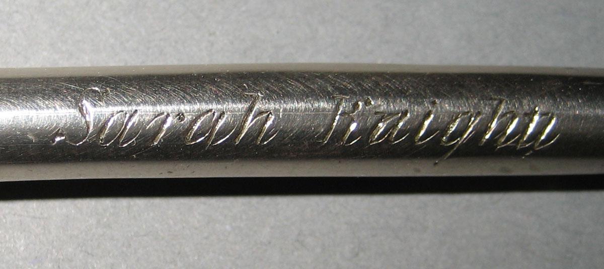 1977.0204  A-H Tool (for sewing) (inscription)