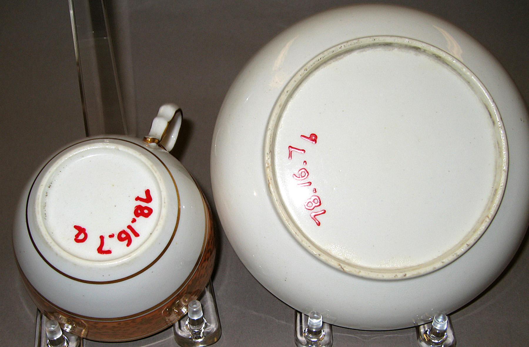1978.0016.007 A, B Bone-china teacup and saucer (undersides)