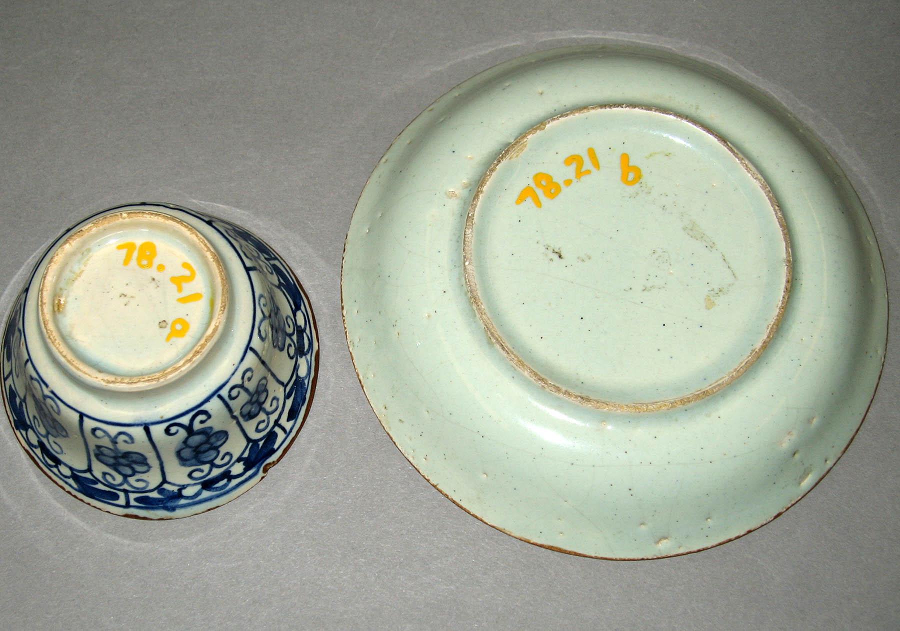 1978.0021 A, B Earthenware teabowl and saucer (undersides)