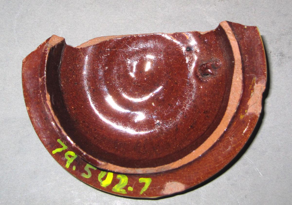 1979.0502.007 Earthenware teapot fragment underside