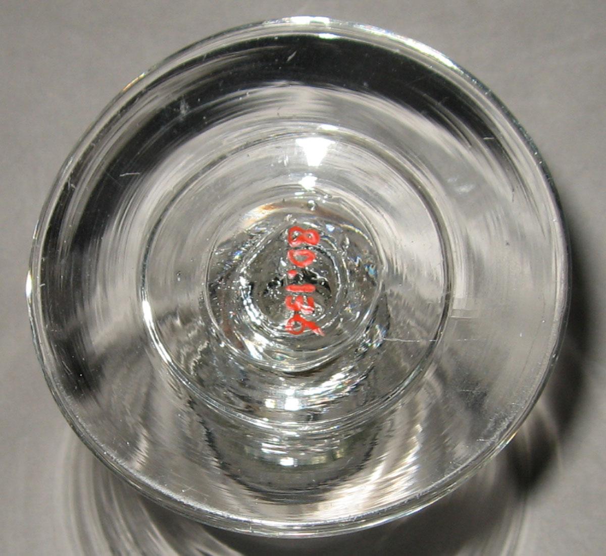 1980.0136 Colorless glass wineglass (underside)