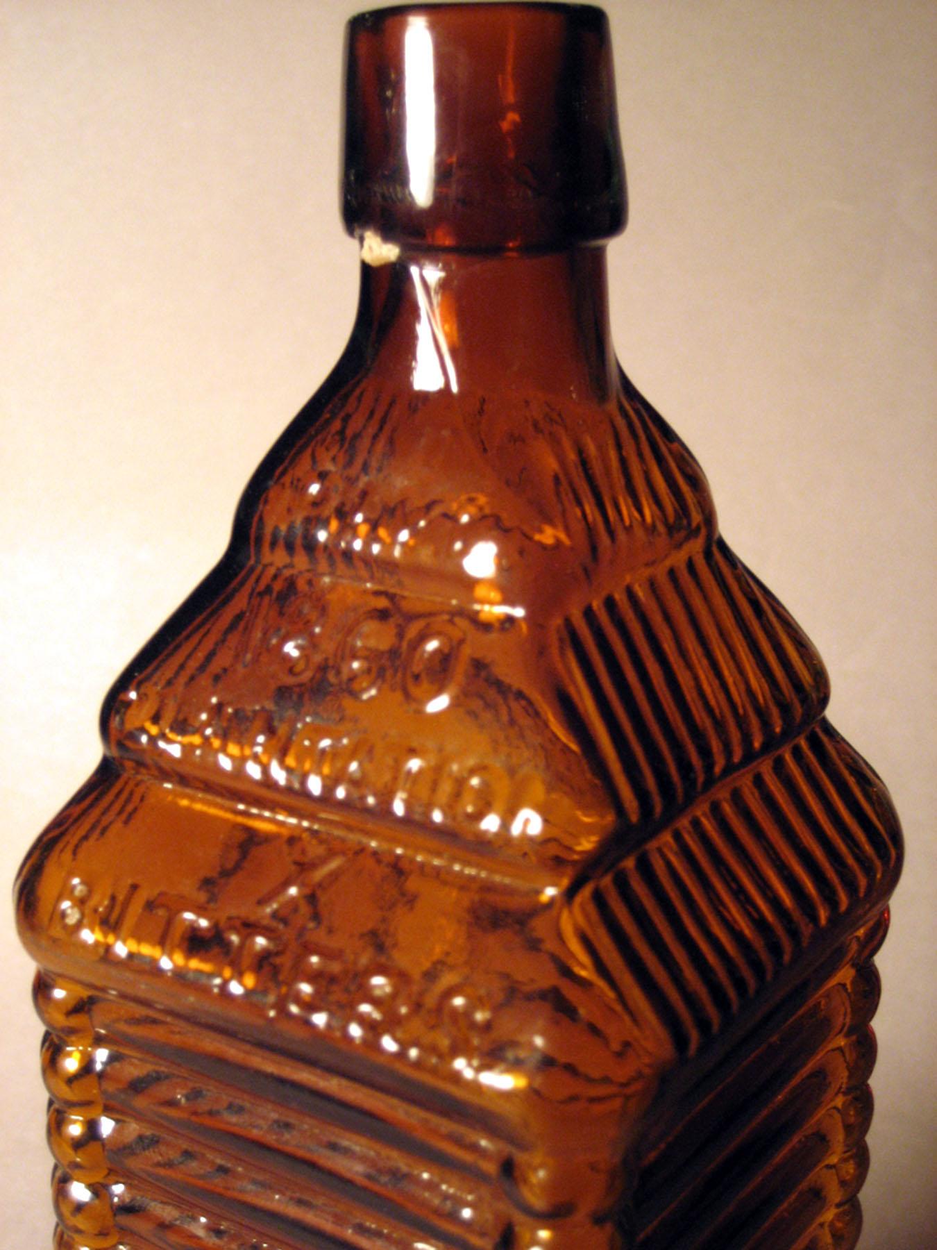 1980.0148 (top side 1) Glass Bitters Bottle