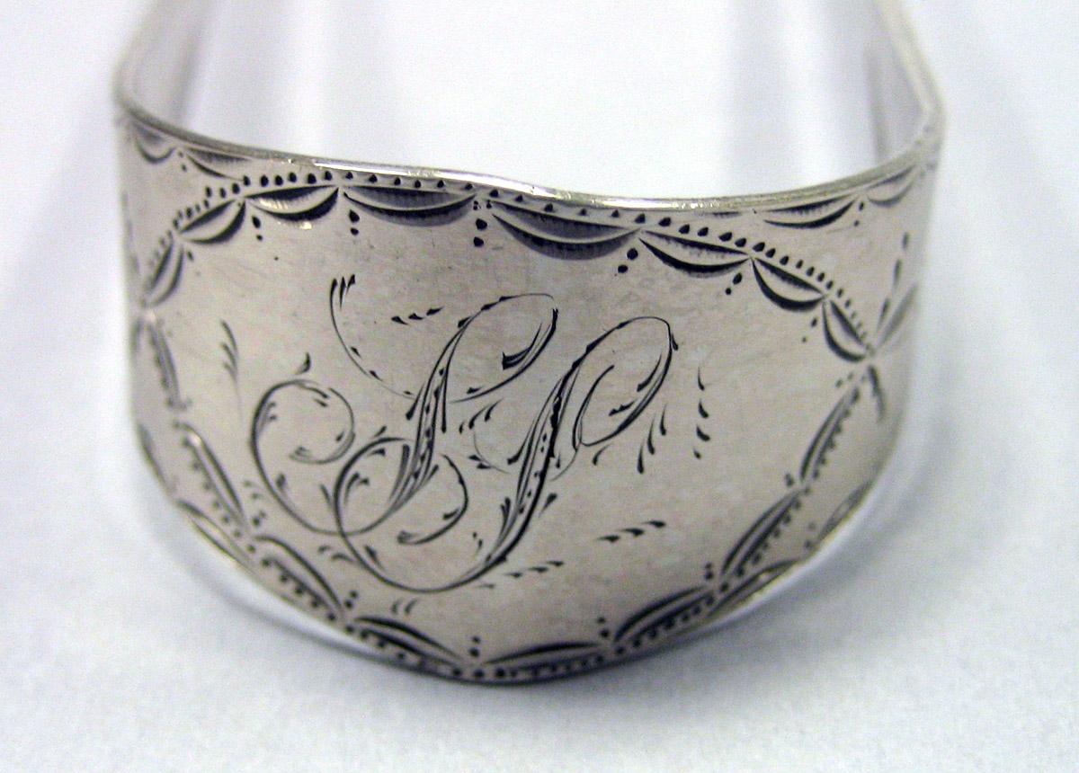 1980.0190 Silver Tongs engraving