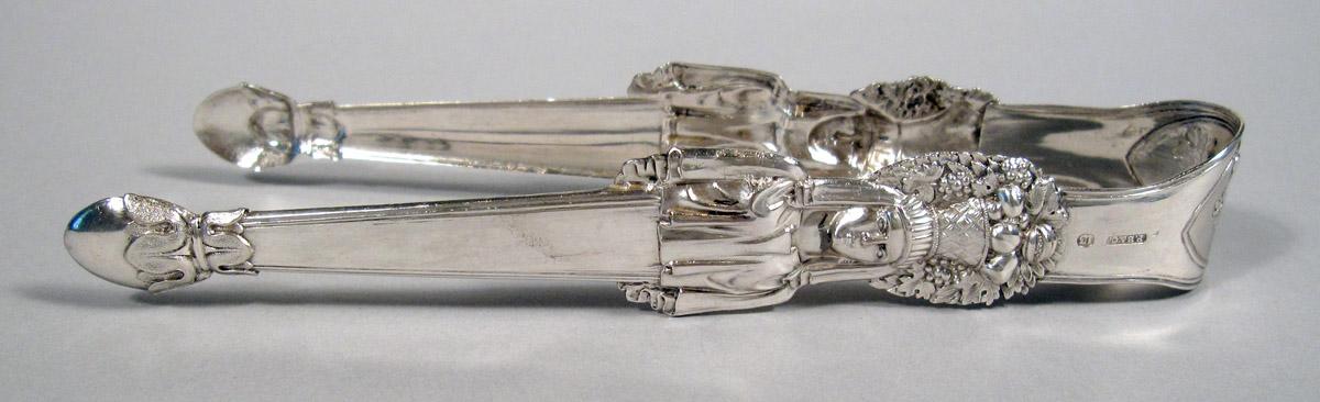 1981.0051 Silver Tongs side view