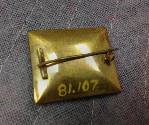 1981.0107 Brooch, view 2, reverse