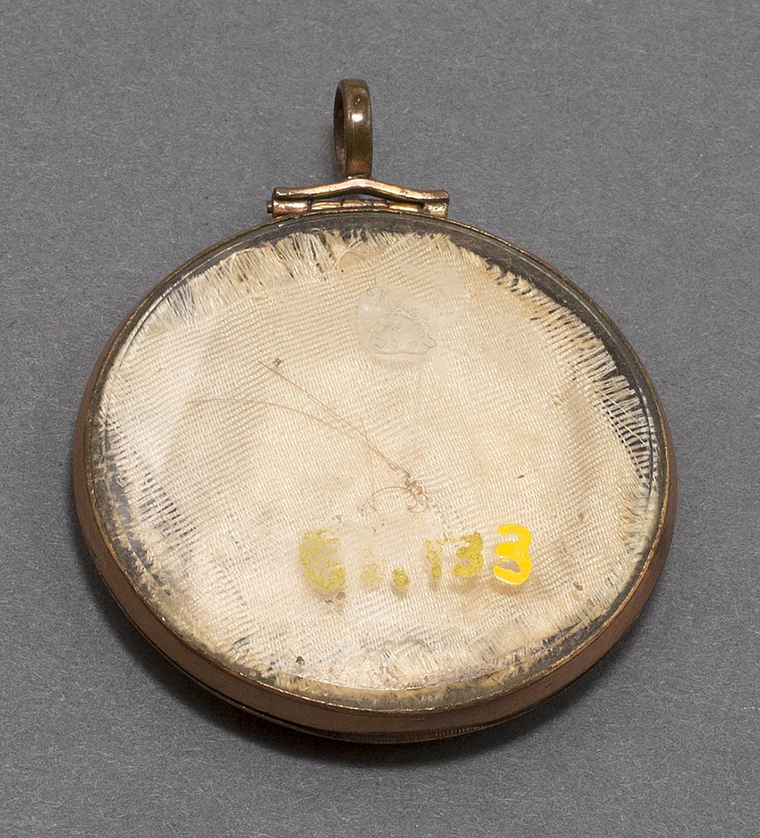 1981.0133 Locket, Verso
