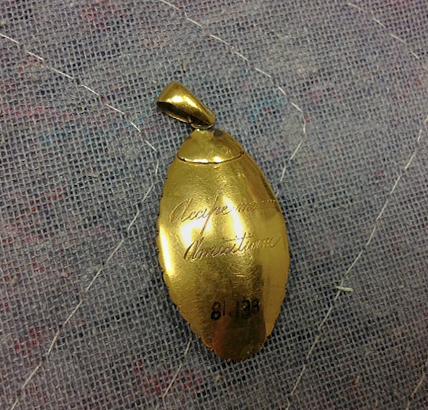 1981.0138 Locket, view 2, reverse