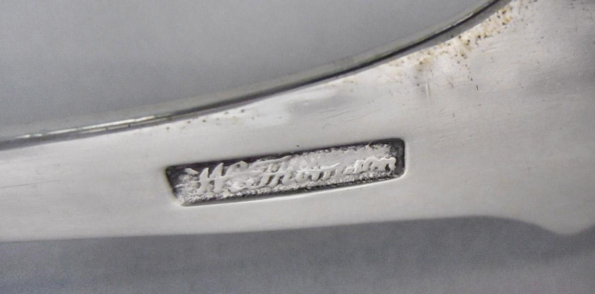 1957.1372 Tongs, mark