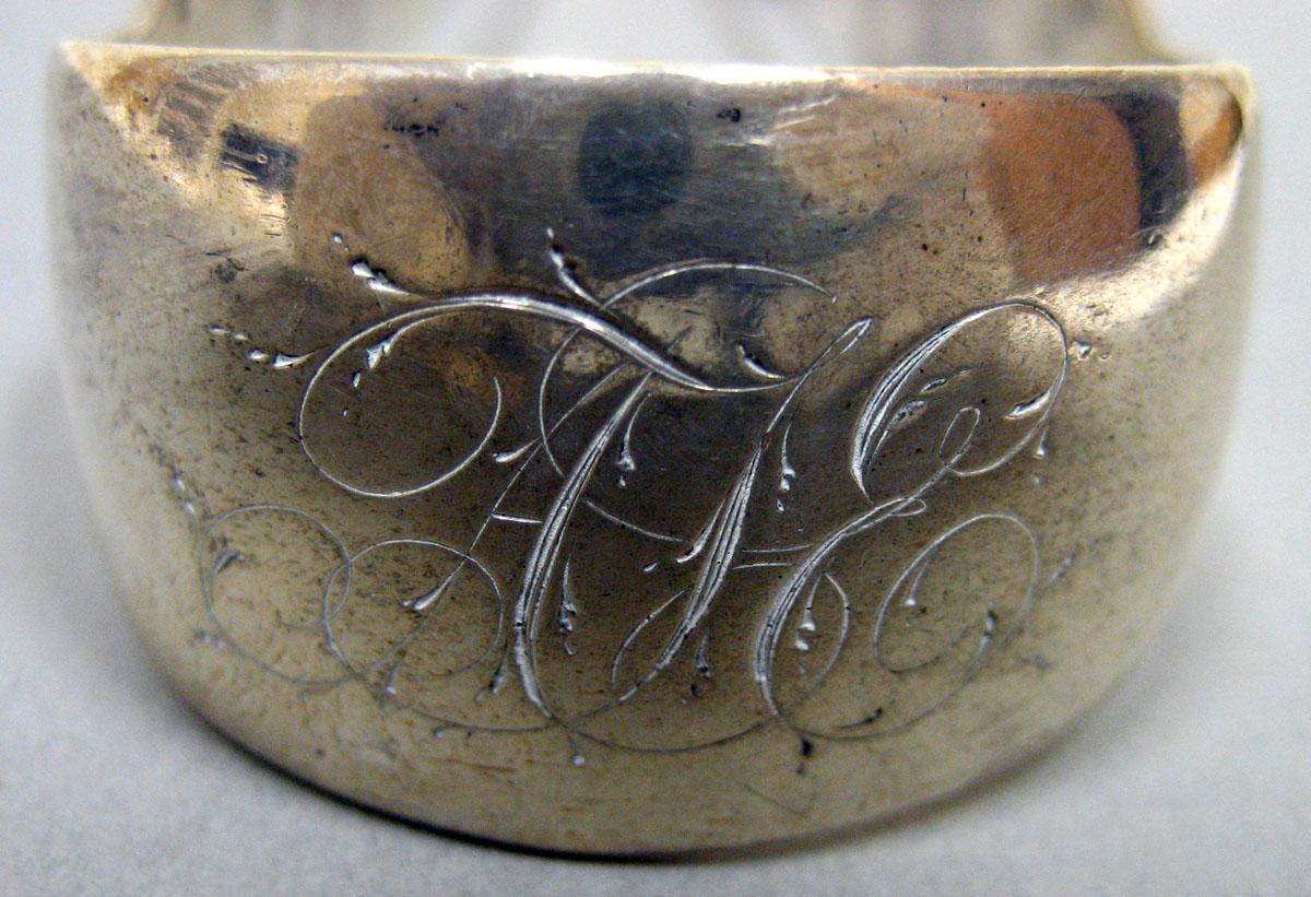1957.1373 Silver Tongs engraving