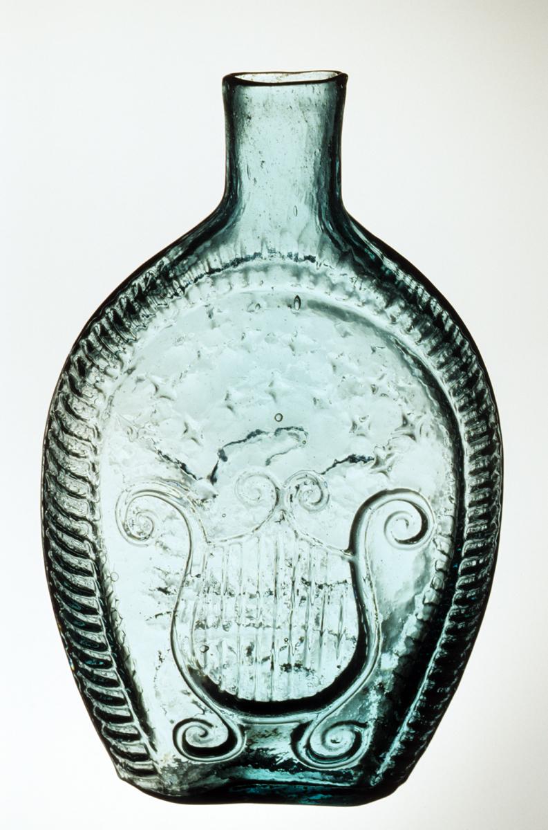 1983.0009 Flask, Side 1