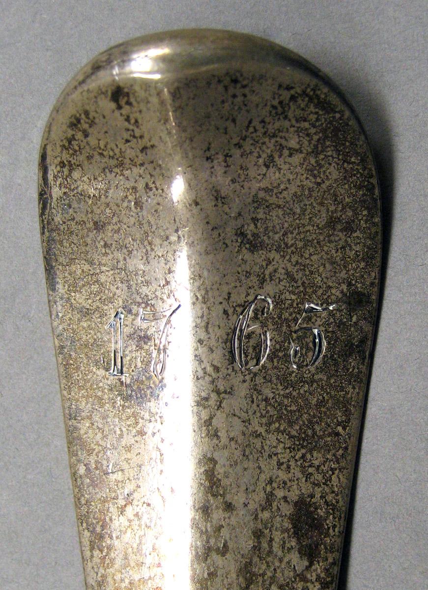1957.1374 Silver Ladle engraving upper surface