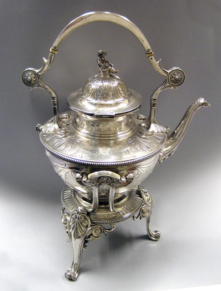1983.0178.001 A-C Silver Kettle on stand side view