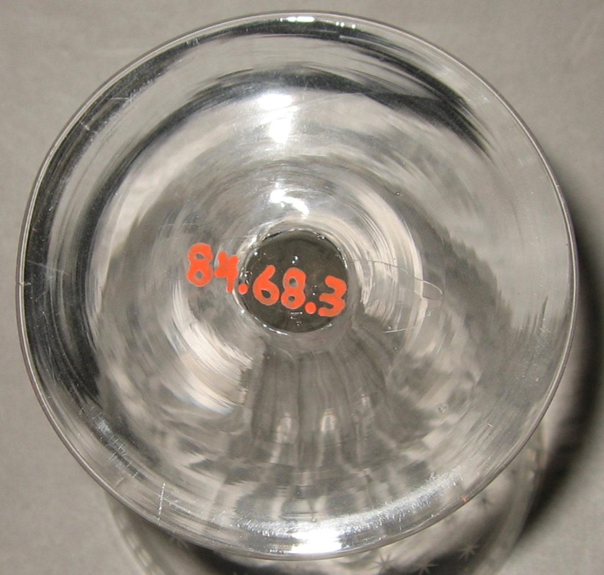 1984.0068.003 Colorless glass champagne glass (underside)