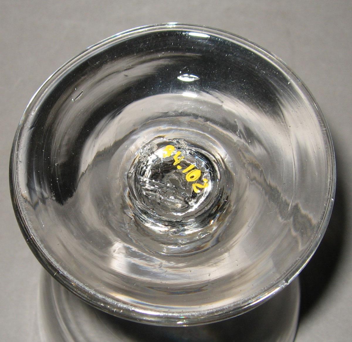 1984.0102 Colorless glass goblet (underside)