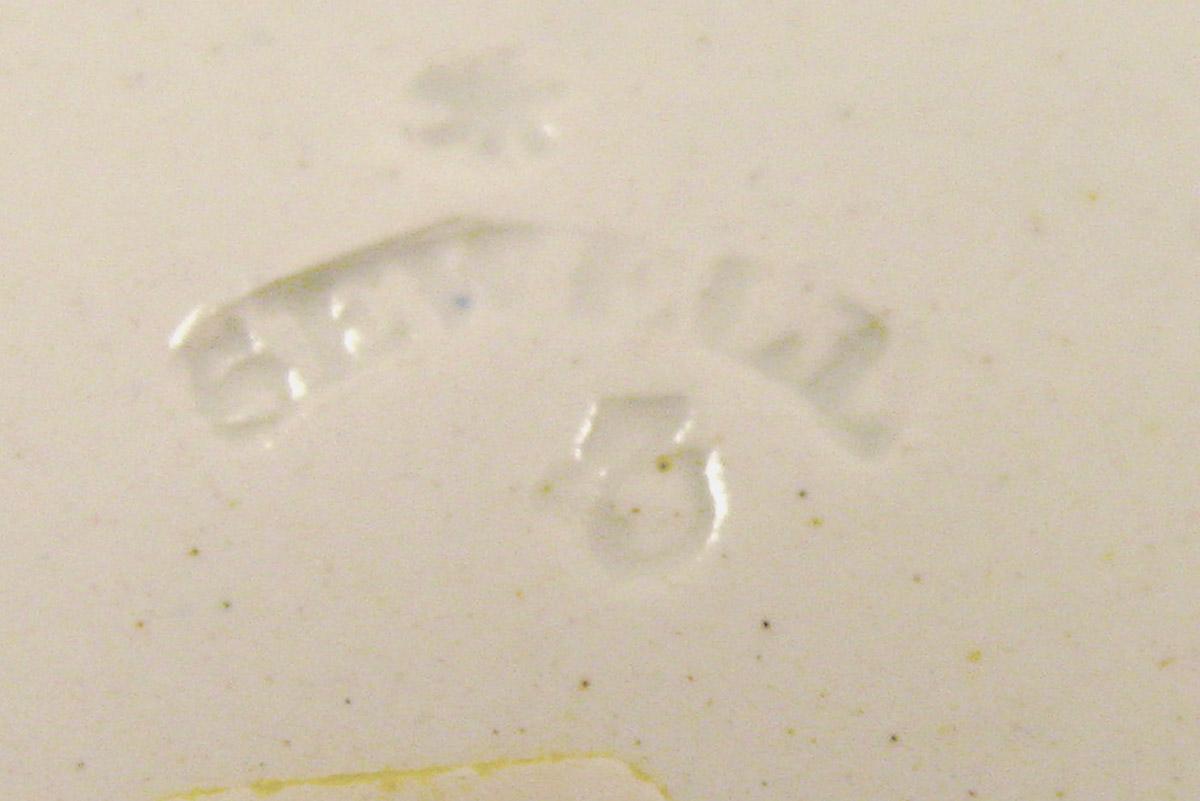 1984.0141.028 B Sewell mark on saucer