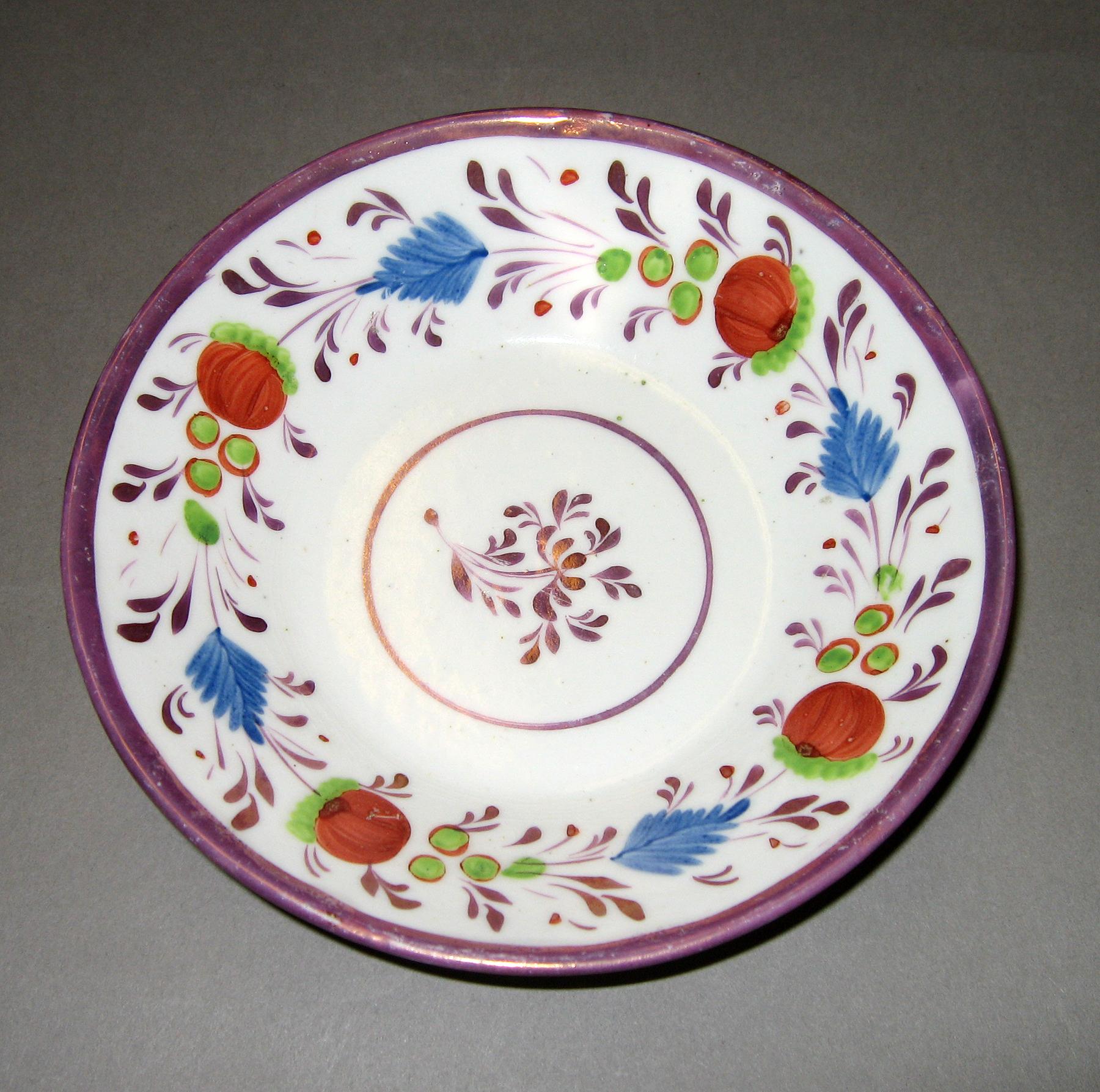 1984.0141.045 B Enamel and pink luster saucer