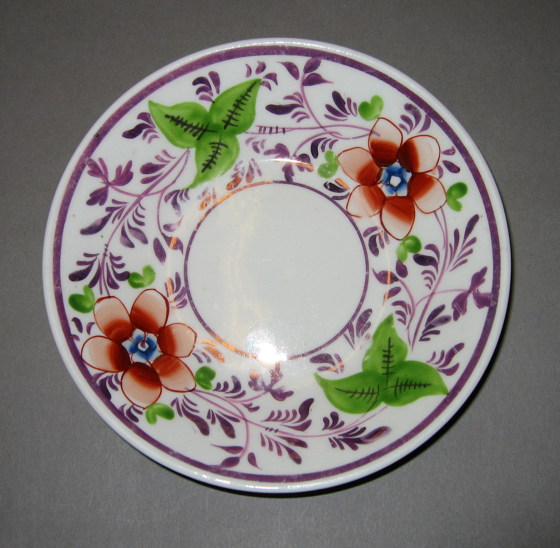 1984.0141.092 B Orange flower pink luster saucer