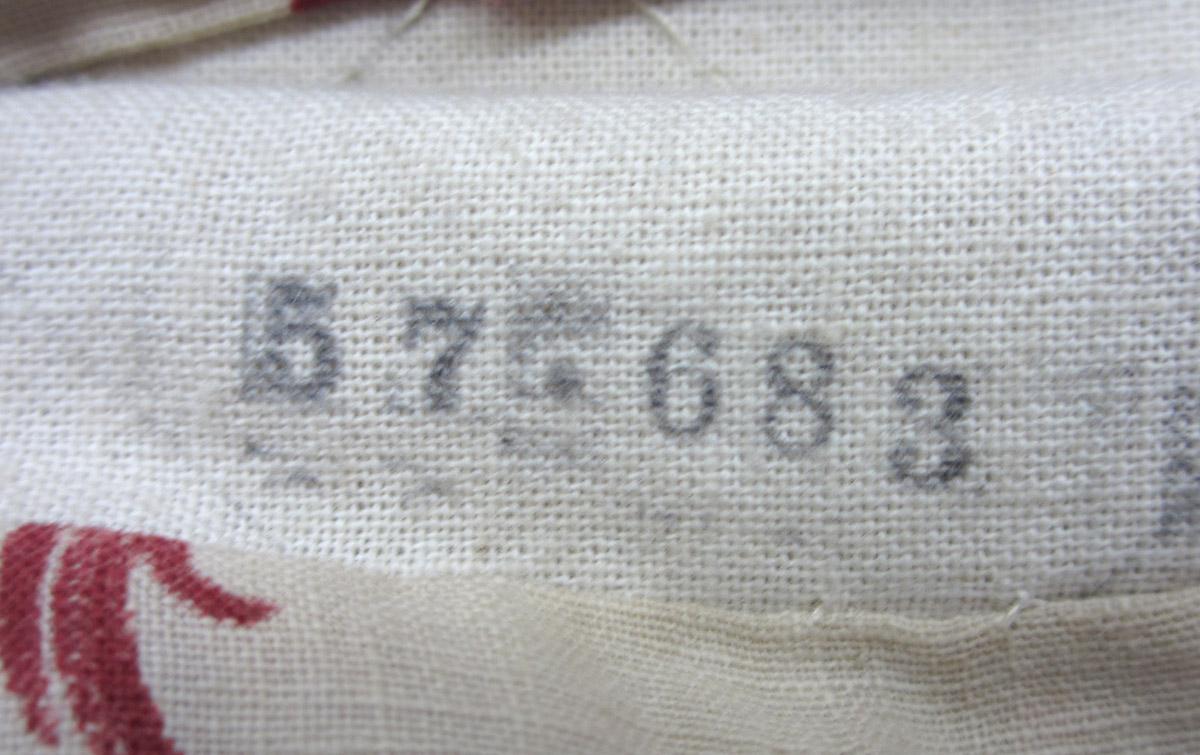 1984.0644.004 C Slip cover inscription