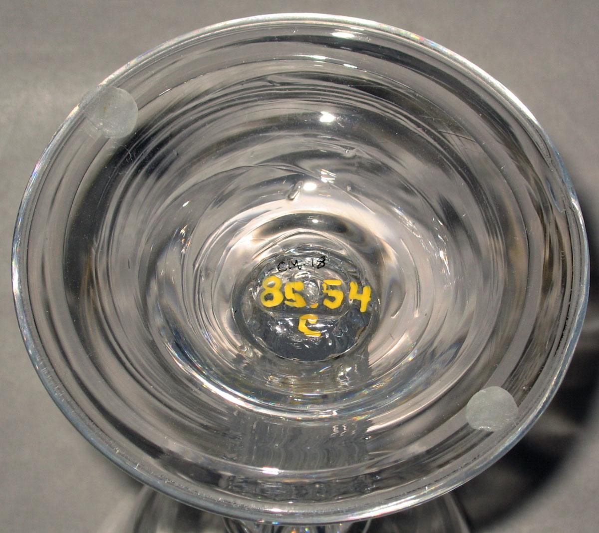 1985.0054 C Colorless glass sweetmeat glass (underside)
