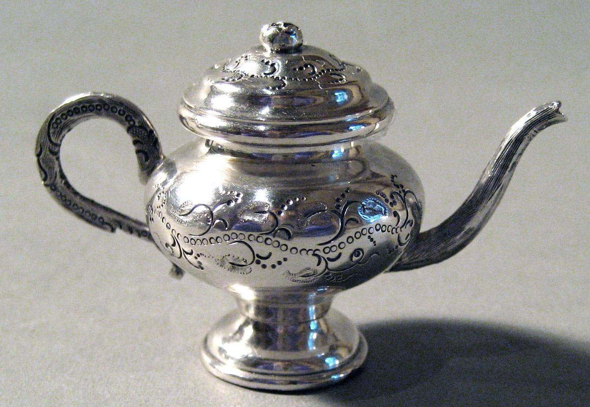 1986.0135.002 A, B Silver Teapot side 2
