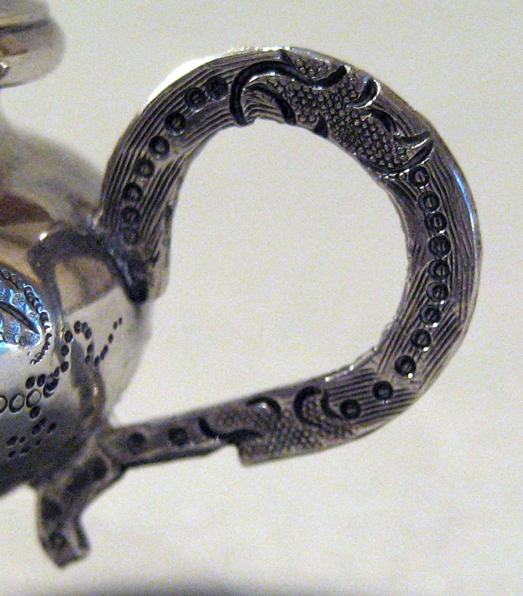 1986.0135.002 A, B Silver Teapot detail handle