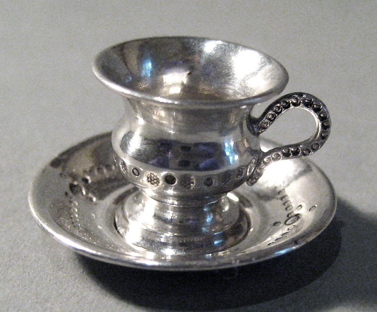 1986.0135.005 A, B Silver Teacup and Saucer