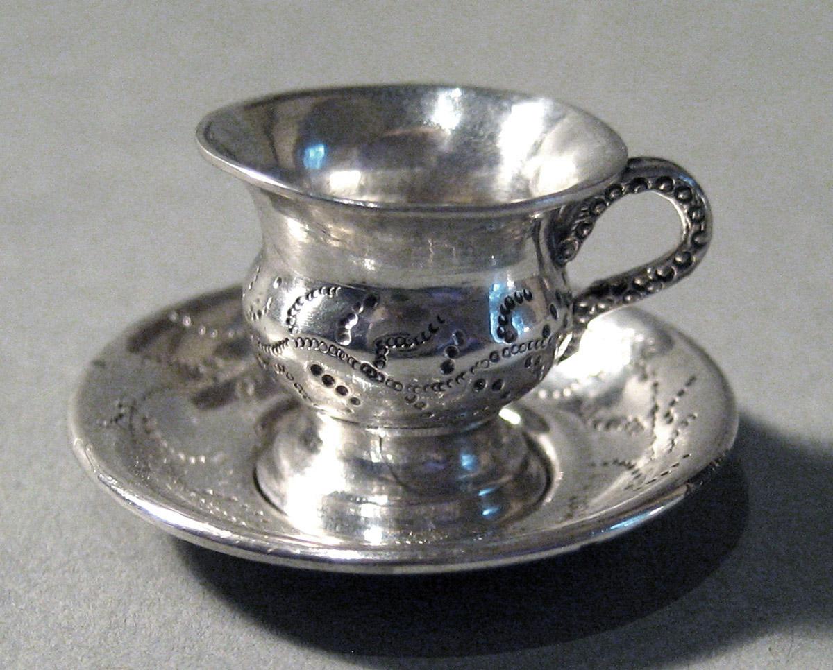 1986.0135.010 A, B Silver Teacup and Saucer