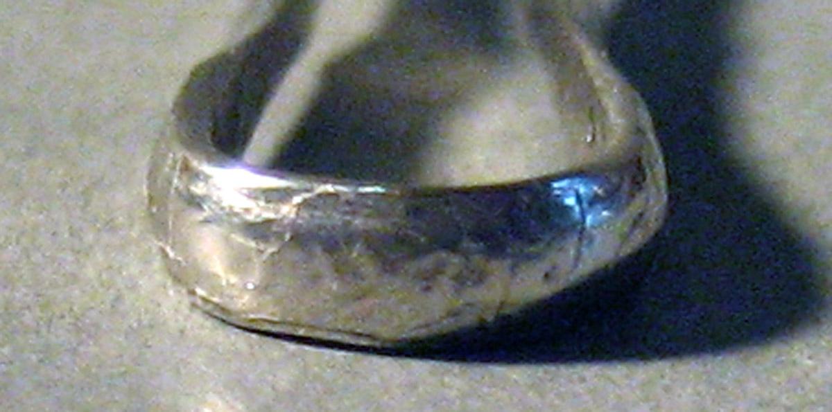 1986.0135.012 Silver Tongs bow