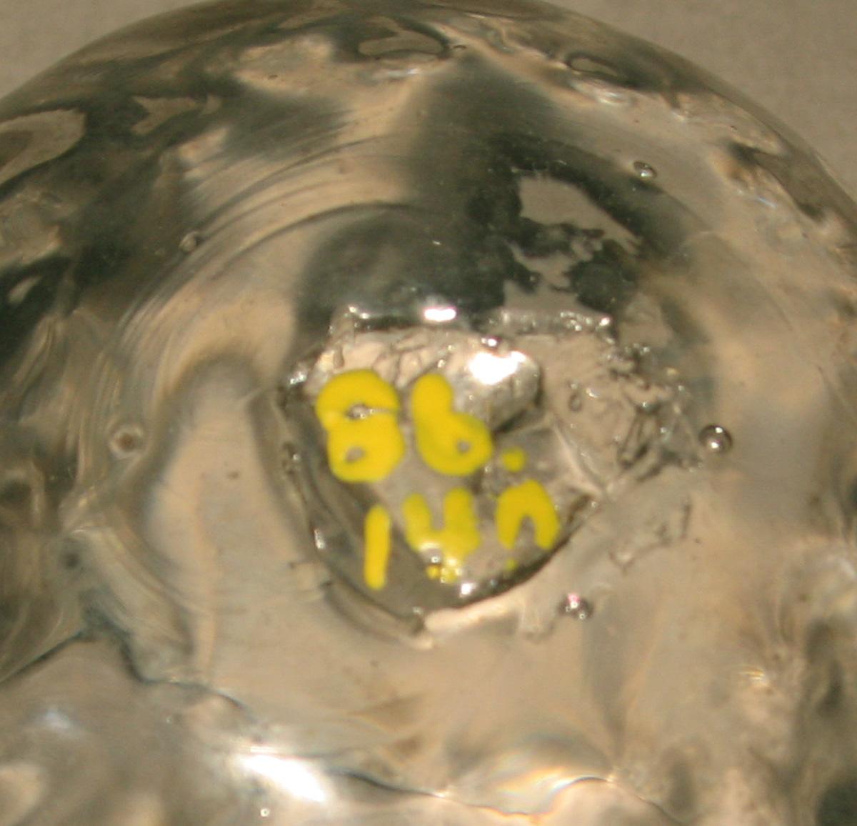 1986.0140 Colorless glass ornament (underside)