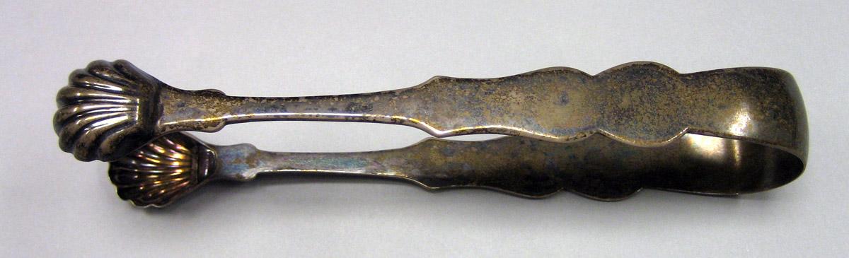 1987.0018 Silver Tongs side 1