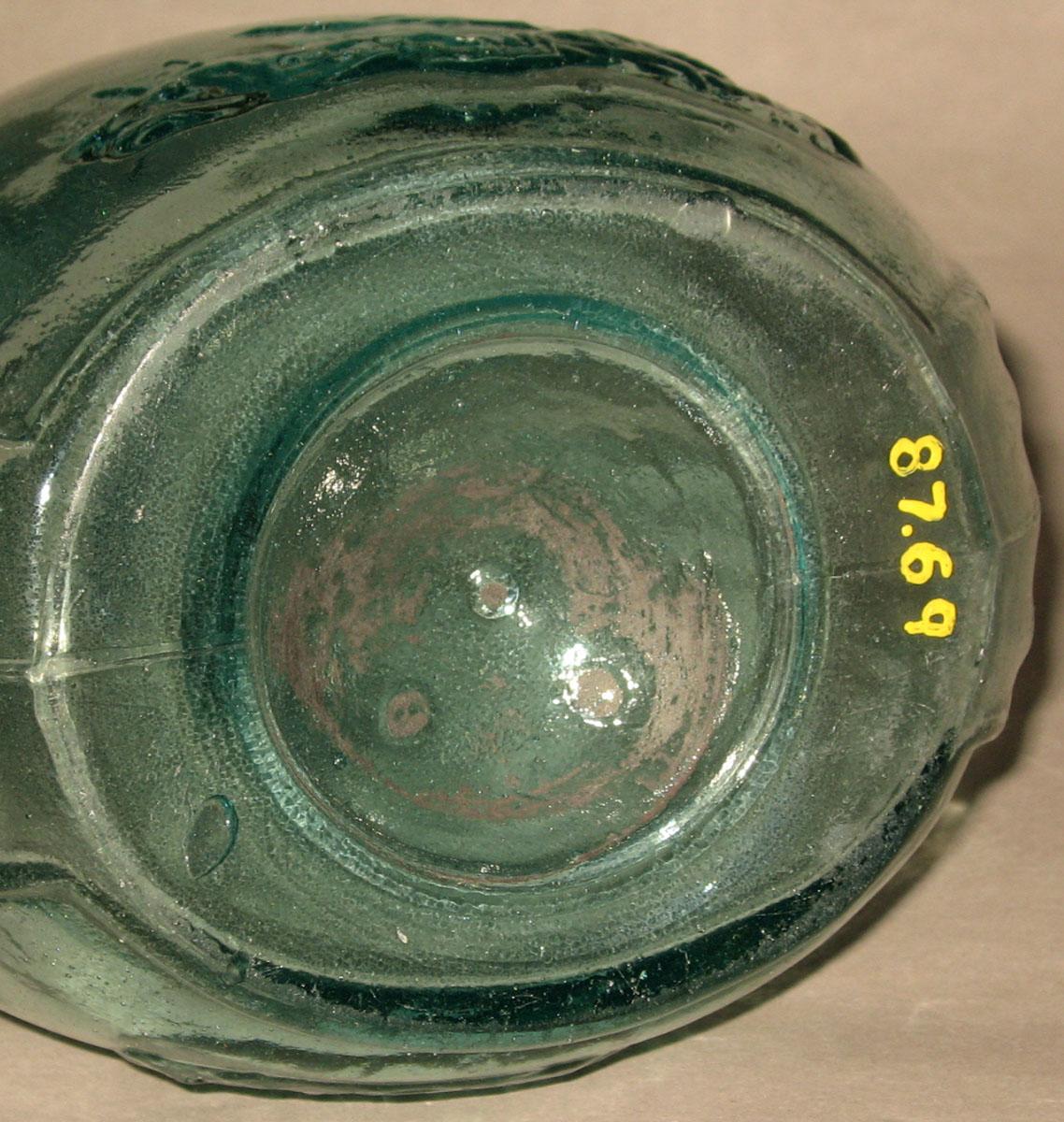 1987.0069 Glass bottle (underside)