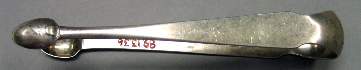 1989.0013.036 Silver Tongs side view