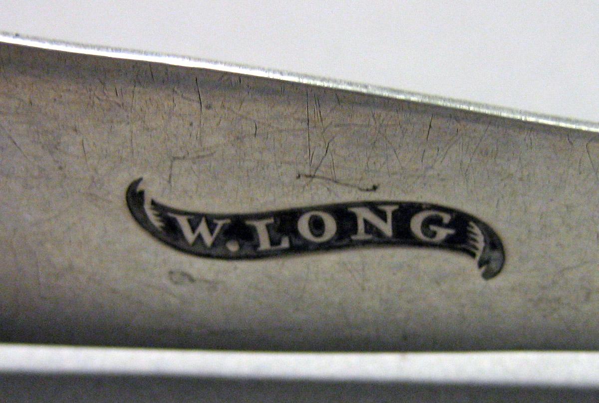 1989.0013.037 Silver Tongs mark 1