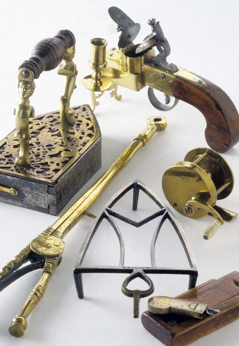 1960.0245, 1984.0136, 1959.2864, 1965.1479, 1952.0266 A-C, 1990.0034, Fishing Reel, Trivet, Pistol Tinderbox, Lighter, Iron, Box Iron, Bleeder and Box, Fleam, Tongs, Pipe Tongs, view 1