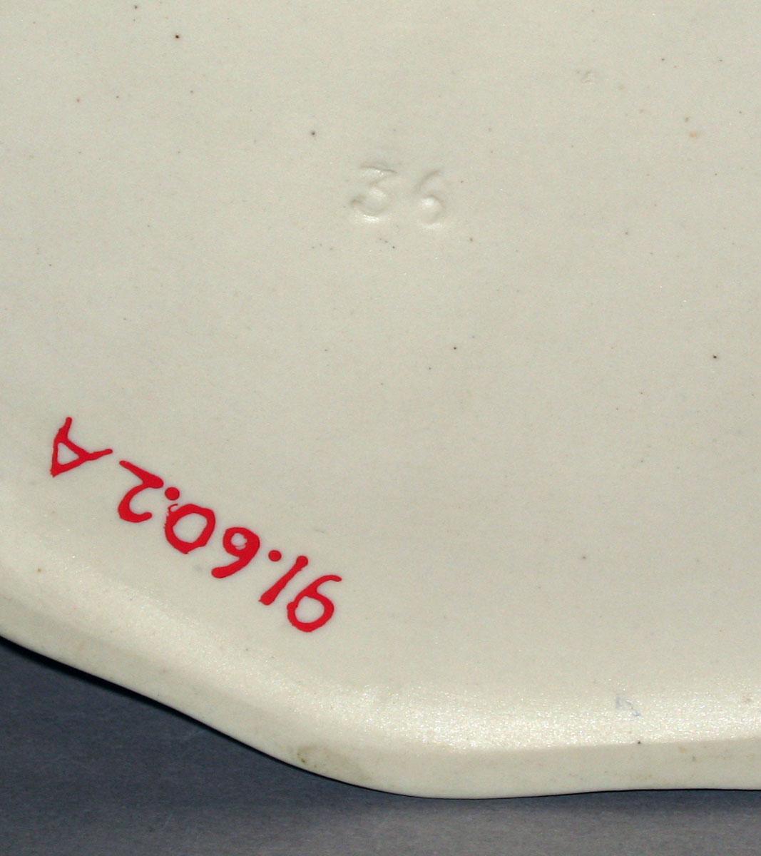 1991.0060.002 A, B White feldspathic stoneware teapot (mark on underside)