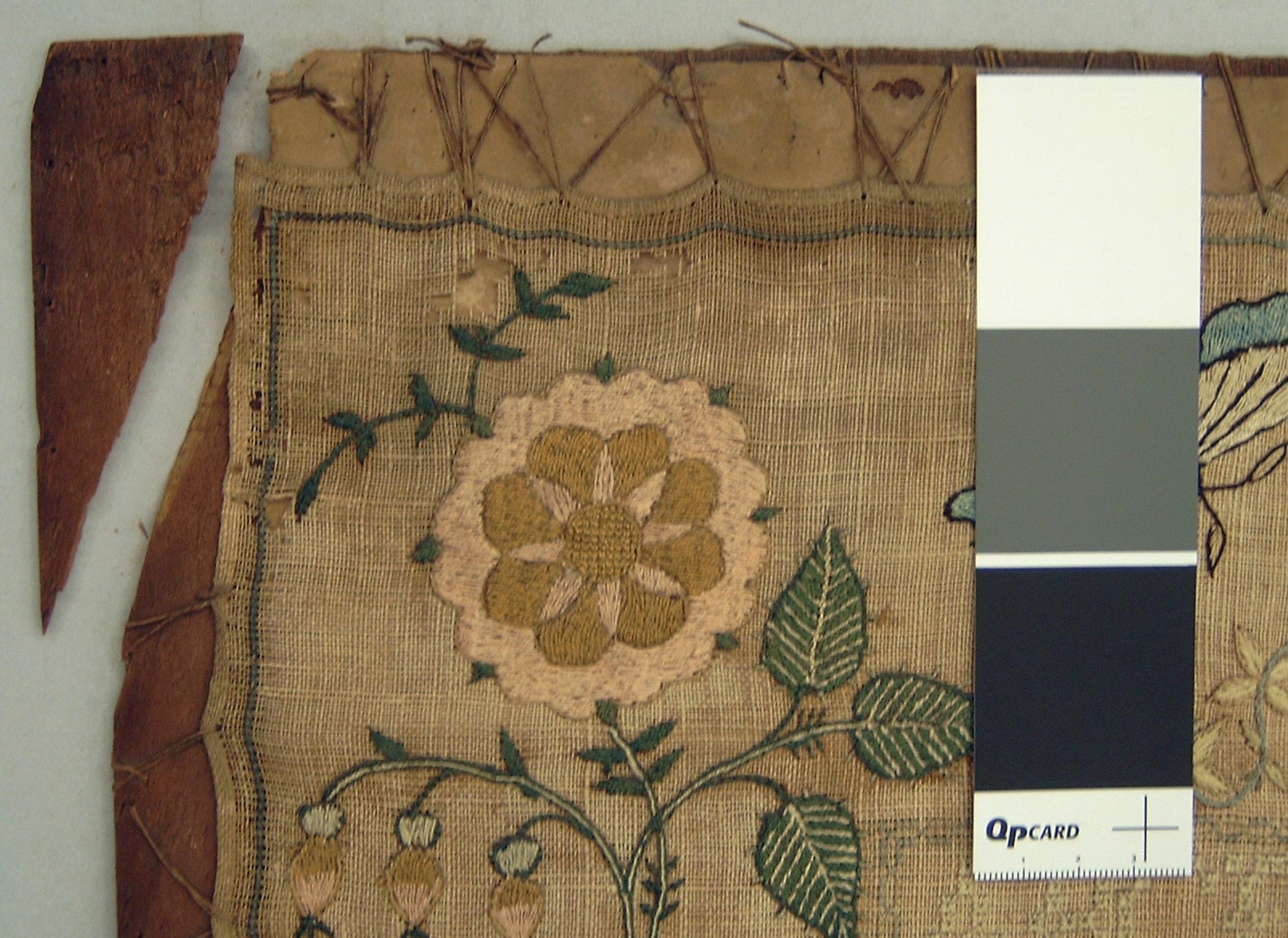 1992.0005 A Sampler, detail 13, broken stretcher, conservation