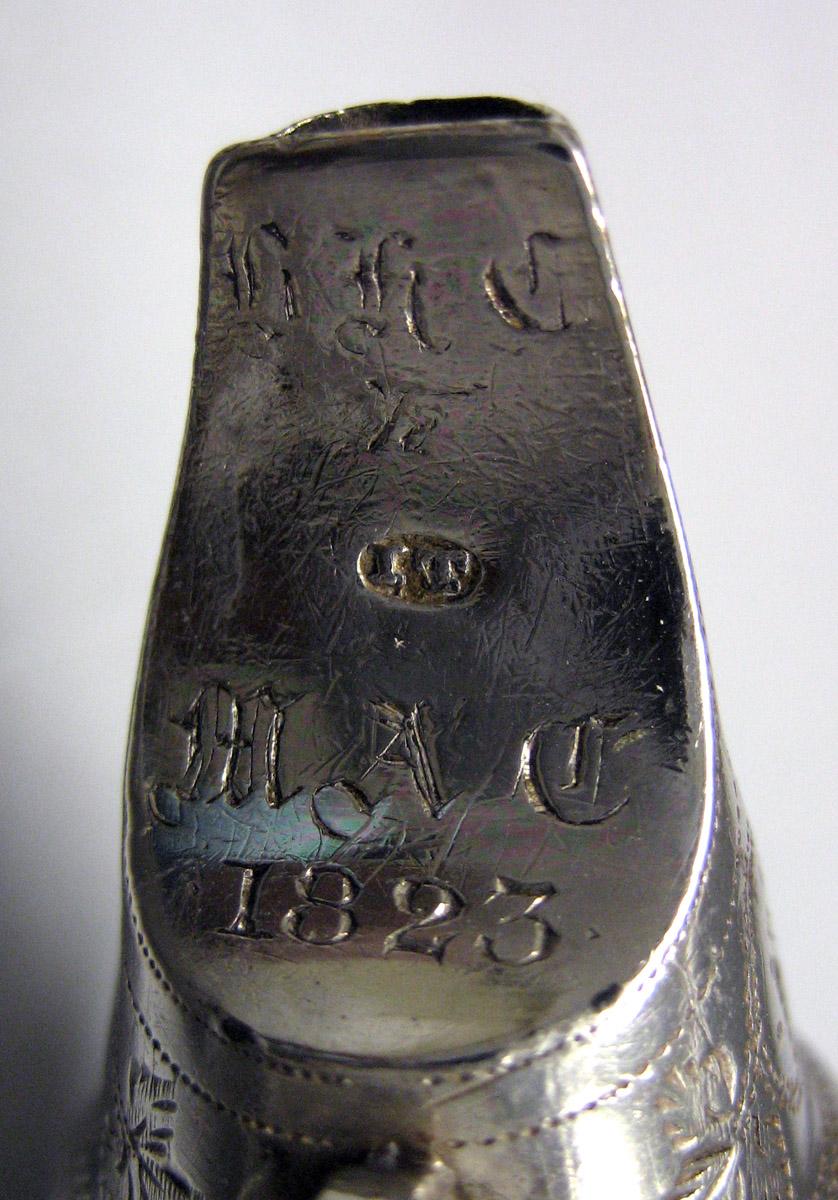 1993.0052 Silver Rattle engraving 2 and mark