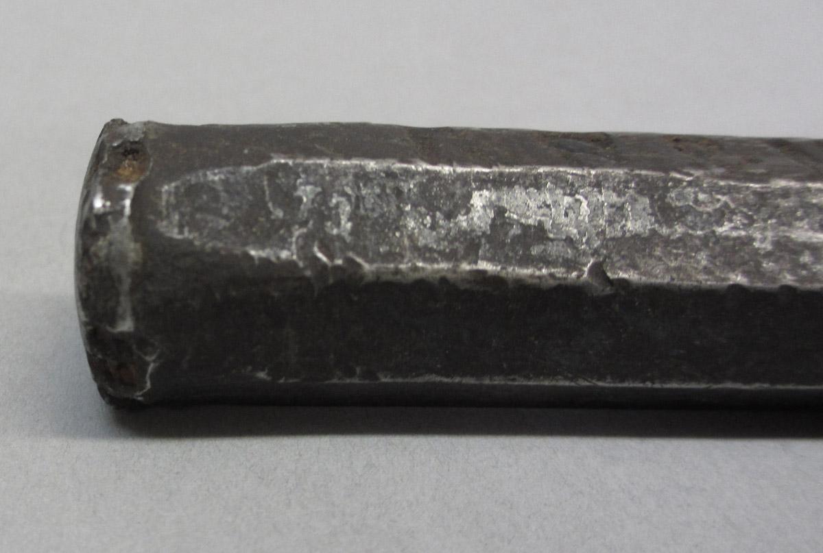 1995.0006.069 Cold chisel, base detail view