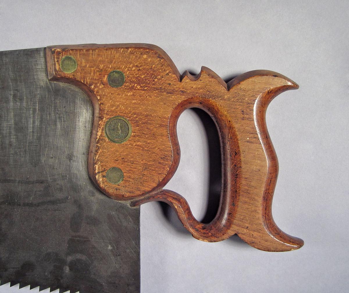 1995.0006.443, Hand saw, handle side 1