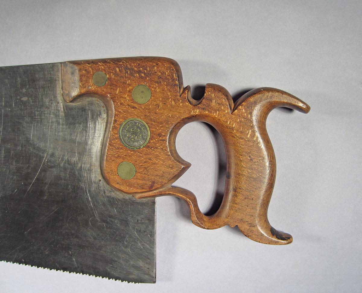 1995.0006.444, Hand saw, handle side 1