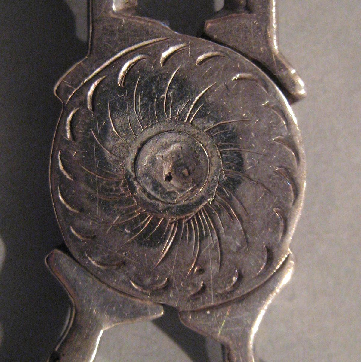 1998.0004.048 Silver Sugar Tongs detail