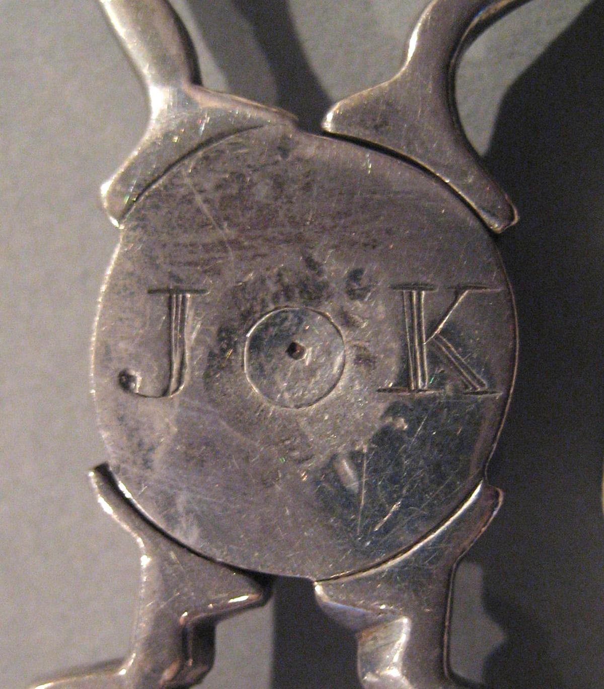 1998.0004.048 Silver Sugar Tongs engraving