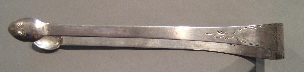 1998.0004.074 Silver Tongs side view