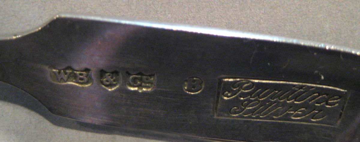 1998.0004.085 Silver Tongs marks
