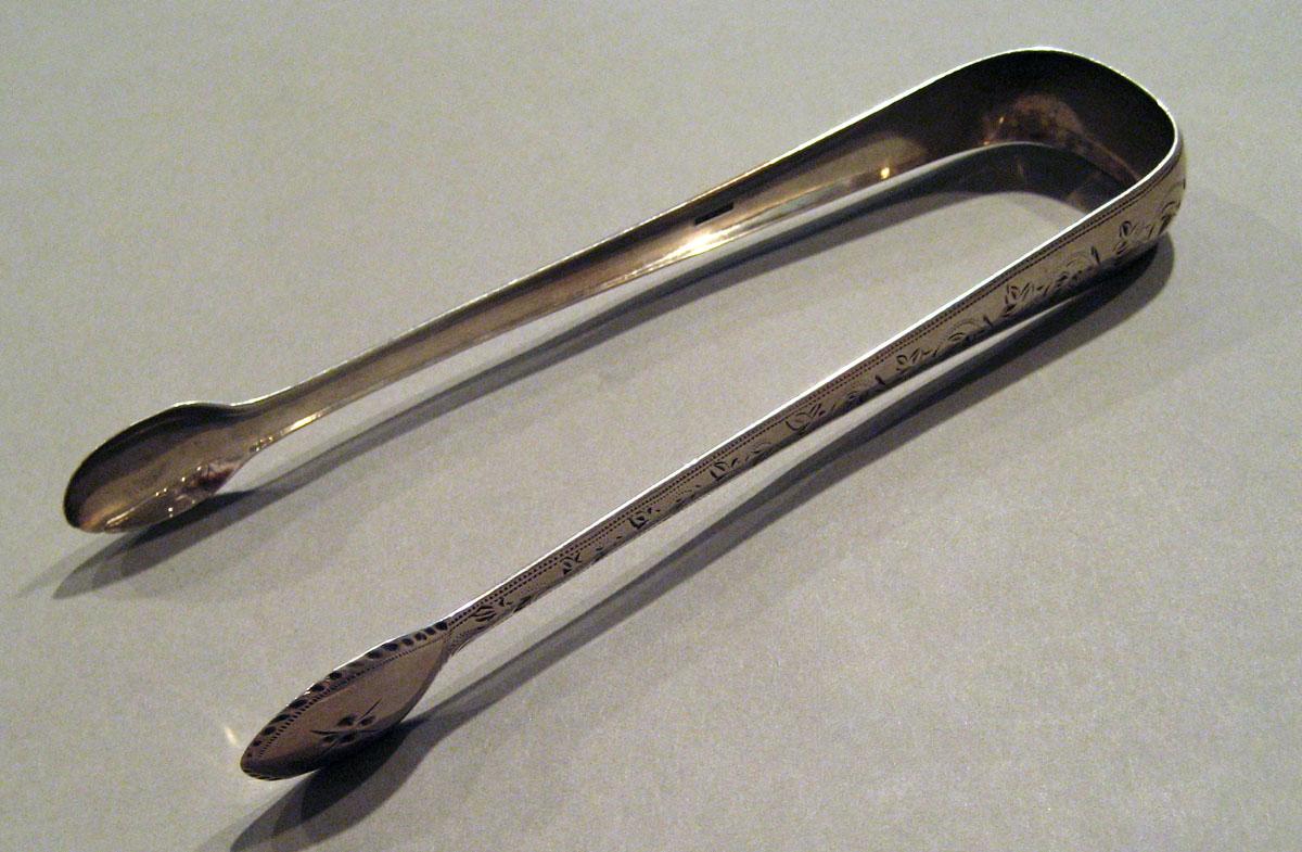 1998.0004.1044 Silver Tongs view 1