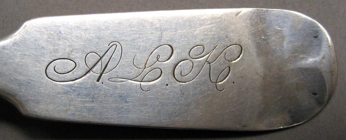 1998.0004.3408 Silver spoon engraving