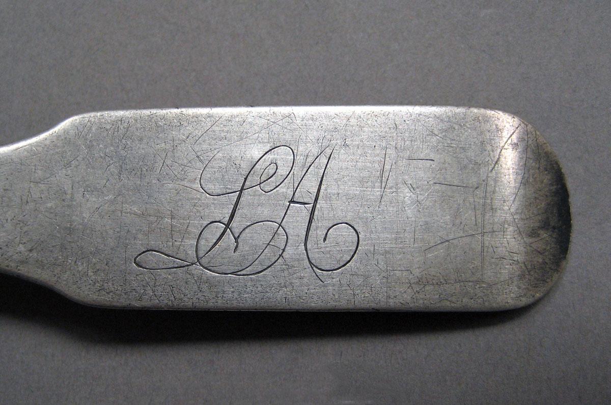 1998.0004.3528  Silver spoon engraving