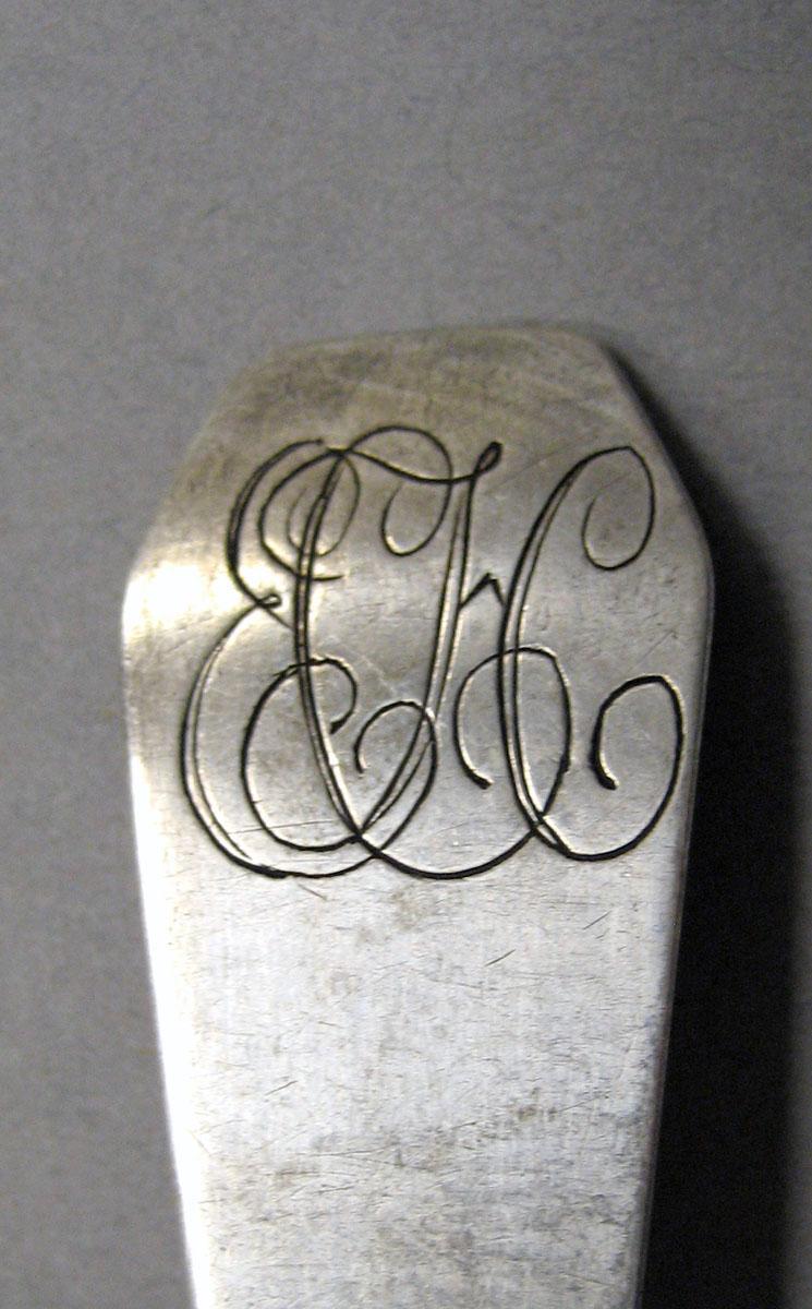 1998.0004.3557 Silver spoon engraving