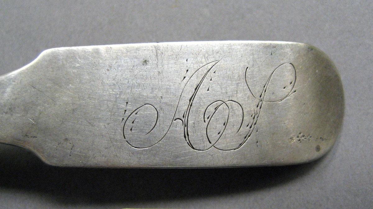 1998.0004.3583 Silver spoon engraving