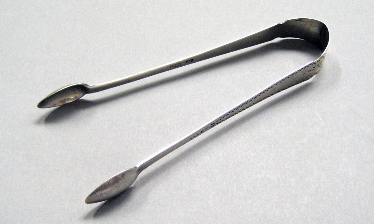 1998.0004.3616 Silver tongs view 1